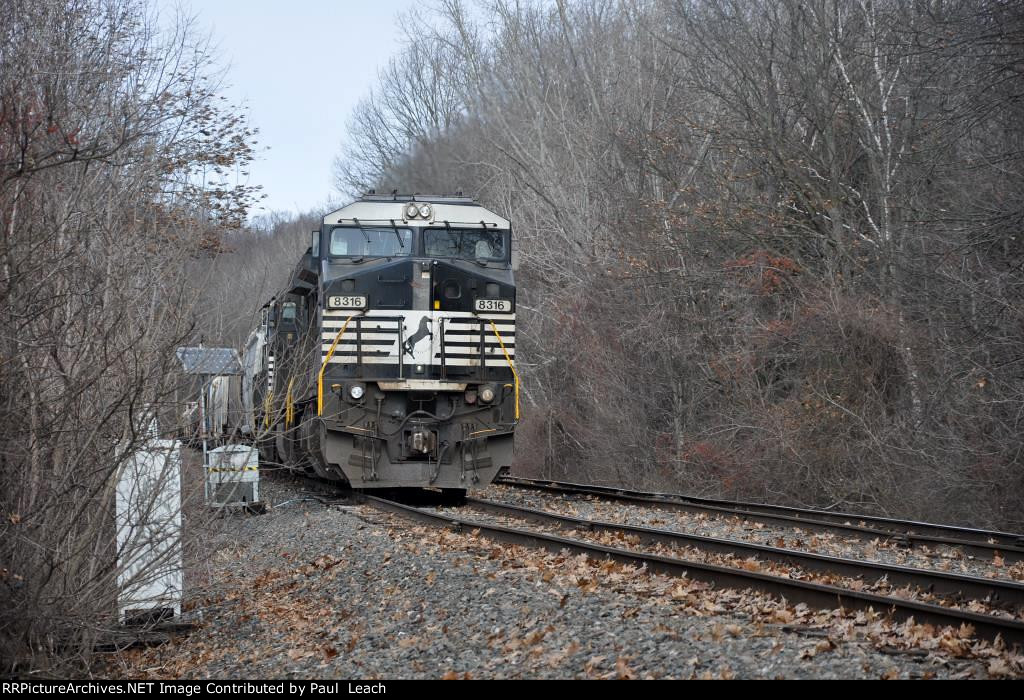 Tied down eastbound manifest waits in the siding